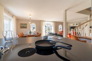 a kitchen with a frying pan on a counter at Haus Hilde in Oevenum