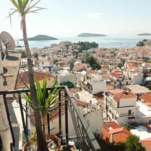 a view of a city from a balcony at PANSION KONSTANTINOS in Skiathos