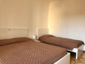 Tempat tidur dalam kamar di Mirafiori Apartment