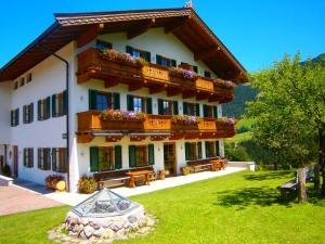 a large building with balconies and flowers on it at Filzenhof in Kitzbühel