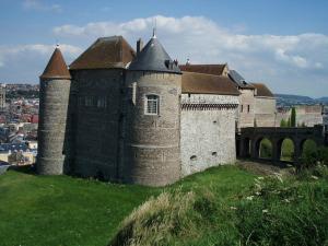 an old castle on top of a green hill at Le Verdier in Dieppe