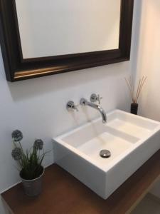 a white sink in a bathroom with a mirror at Charming Suite Private Wc & Balcony in Lisbon