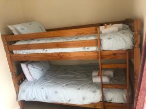 a couple of bunk beds in a room at Wayfarer Inn in Instow
