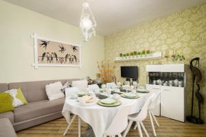 a living room with a white table and a couch at Casa Morais in Odeceixe