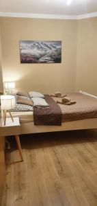 Ένα ή περισσότερα κρεβάτια σε δωμάτιο στο Apartamenty w Jantar - LilaSun