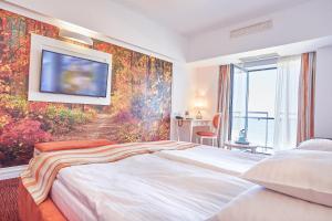 Кровать или кровати в номере Continental Forum Constanta
