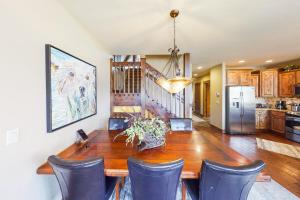 a dining room with a wooden table and chairs at Buffalo Lodge Townhomes 1293 in Silverthorne