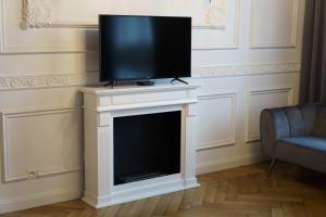 Televízia a/alebo spoločenská miestnosť v ubytovaní Prestige Apartment Rynek Kielce