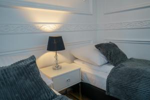 Posteľ alebo postele v izbe v ubytovaní Prestige Apartment Rynek Kielce