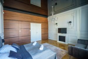 Televízia a/alebo spoločenská miestnosť v ubytovaní Prestige Apartment Rynek Kielce