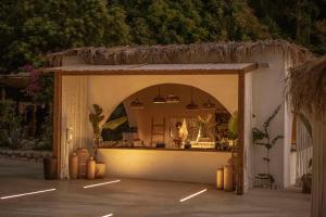 a shop with a woman in the reflection in a mirror at Maya Beach Resort in Massa Lubrense