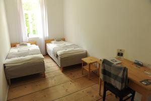 Postel nebo postele na pokoji v ubytování Grand Hotel Ushba