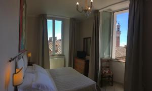 Vuode tai vuoteita majoituspaikassa I Terzi Di Siena - Rooms Only