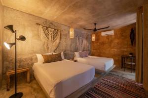 Postel nebo postele na pokoji v ubytování Casa Coyote Tulum
