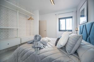 En eller flere senge i et værelse på Bimba's