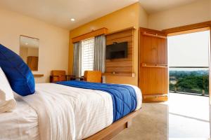 Postel nebo postele na pokoji v ubytování HOTEL TAIKA