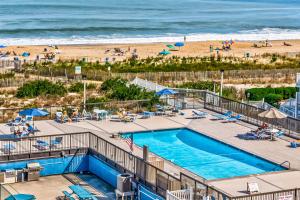 an overhead view of a swimming pool and the beach at Fountainhead Towers in Ocean City