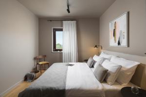 Posteľ alebo postele v izbe v ubytovaní Apartman Colmo s hidromasažnom kadom