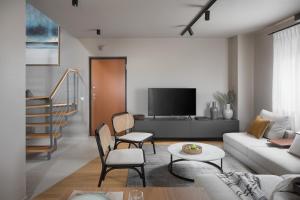 Televízia a/alebo spoločenská miestnosť v ubytovaní Apartman Colmo s hidromasažnom kadom