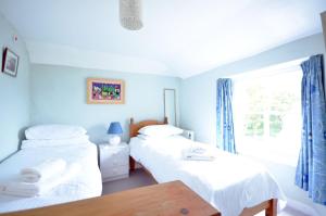 A bed or beds in a room at Westover, St Mawes