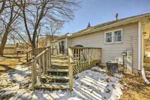a house with a wooden staircase in the snow at Twin Lakes Escape with Deck Less Than 1 Mi to Beach! in Twin Lakes