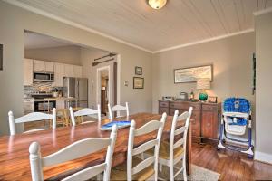 a kitchen and dining room with a table and chairs at Urbanna Cottage with Private Yard and Water Views in West Irvington