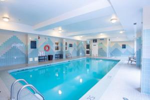 a large swimming pool in a hotel room at Sandman Hotel Vancouver Airport in Richmond