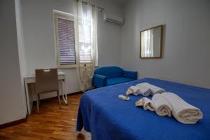 Postel nebo postele na pokoji v ubytování Ai Bastioni del Massimo