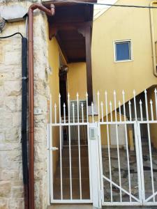 a gate in front of a house with a fence at Casa Giulia in Torre Canne