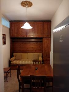 a dining room with a couch and a table at Casa Giulia in Torre Canne