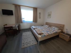 Posteľ alebo postele v izbe v ubytovaní Ferienwohnung Huber