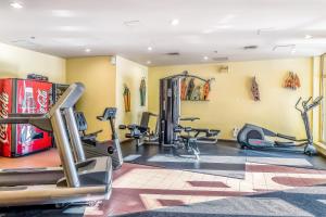 a fitness room with treadmills and machines at Cascade Lodge in Whistler