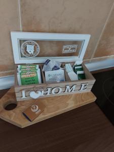 a wooden box filled with different types of soap at Pegaz009**** in Vrnjačka Banja