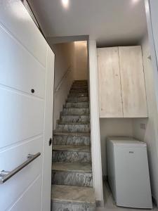 a staircase in a room with a toilet at Aura b&b in Bari