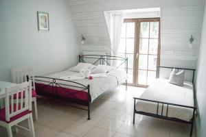 Postel nebo postele na pokoji v ubytování H2O