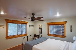 a bedroom with a bed and a window at Zion Ponderosa Ranch Resort in Springdale