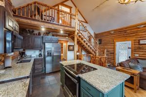 a kitchen with wooden walls and a wooden staircase at Zion Ponderosa Ranch Resort in Springdale