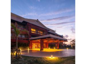 a rendering of a building at dusk at Miyakojima Kurima Resort Seawood Hotel - Vacation STAY 16235v in Uechi