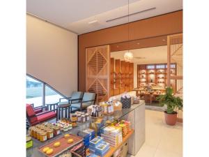 a lobby with a counter with food on it at Miyakojima Kurima Resort Seawood Hotel - Vacation STAY 16226v in Uechi