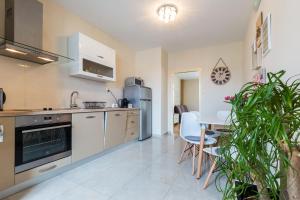 a kitchen and dining room with a table and chairs at Calle Larga 14 apartment in old town in Zadar