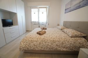 Posteľ alebo postele v izbe v ubytovaní Casa La Cartolina