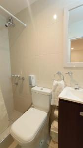 a bathroom with a toilet and a sink and a shower at Hotel Dinastia Boutique in Salta +29 photos