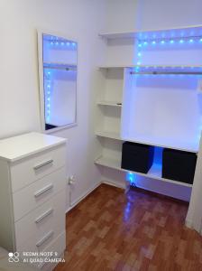 a bedroom with a white dresser and a window at Aventura Playa y Sol Santa Pola in Santa Pola