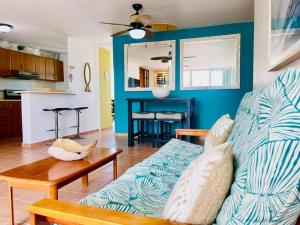 a living room with a couch and a table at 3Bedrm Beach Penthouse with Rooftop Terrace & WiFi in Rio Grande