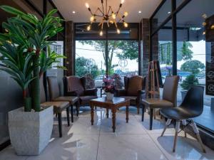 a waiting room with chairs and a table at Hope Hotel Masai in Masai