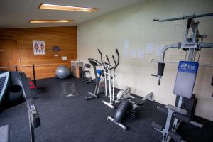 a gym with several exercise equipment in a room at Southern Cross Lodge Methven in Methven