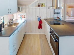 a kitchen with a sink and a counter top at 6 person holiday home in Hemmet in Hemmet