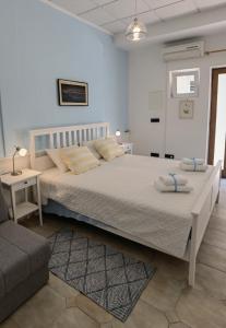 a bedroom with a large bed and a couch at RIO B&B, 5 stars SUPERIOR room, near the sea and park in Novigrad Istria