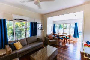 a living room with a couch and a table at Kooyong Apartment 1 in Arcadia