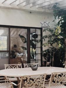 a table with a bowl on it in a room at Artvilla Village in Xihu